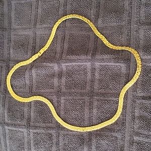 Elegant gold tone chain necklace.